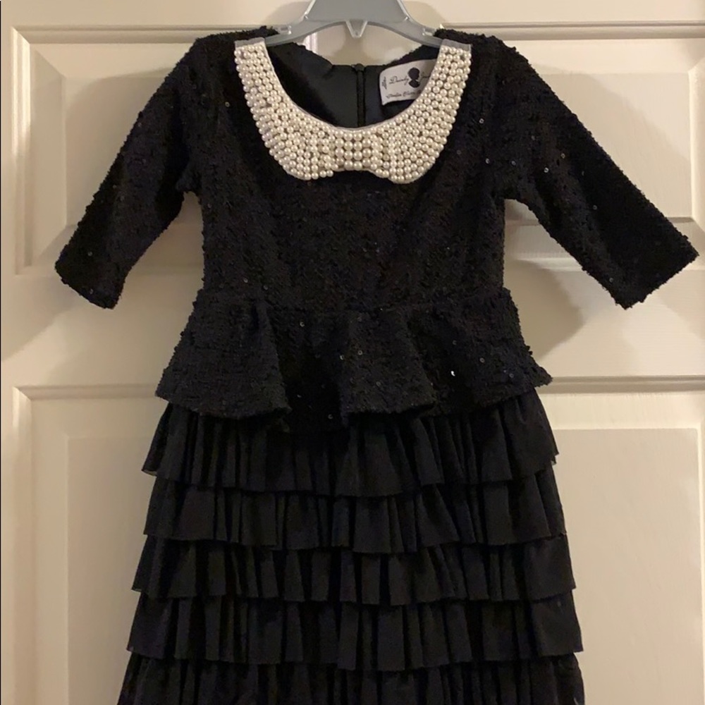 Dainty Jewels. Black dress with pearl collar